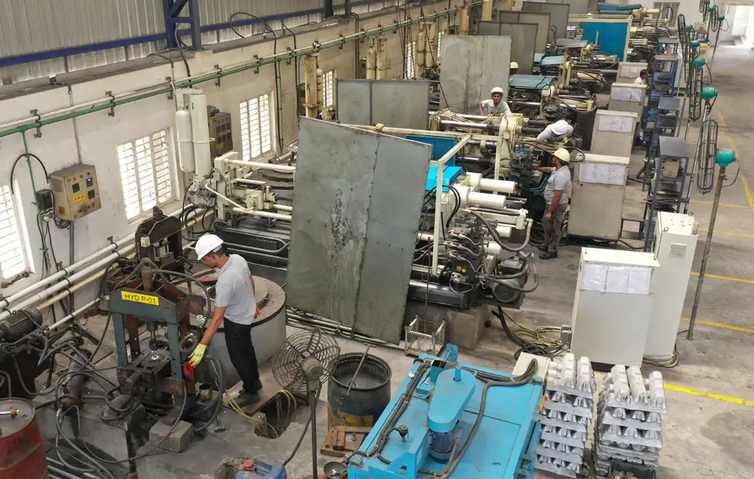 CNC machining shop floor with workers operating machines
