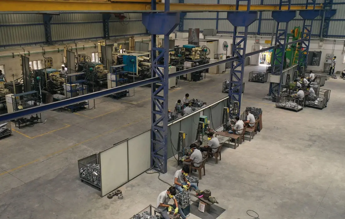 Factory workshop with multiple machining stations and workers