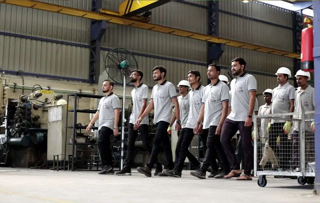 Industrial workers in safety gear walking