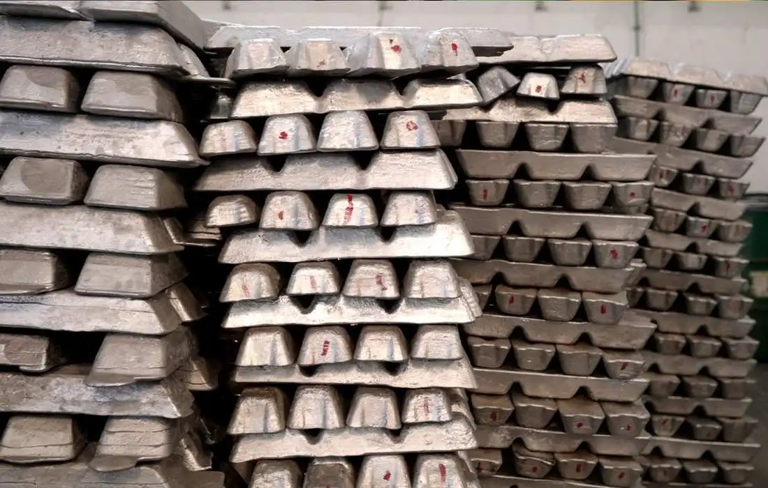 Stacks of aluminum ingots arranged in a warehouse