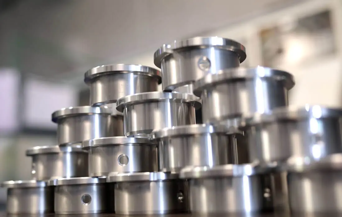 Finished precision-machined metal components