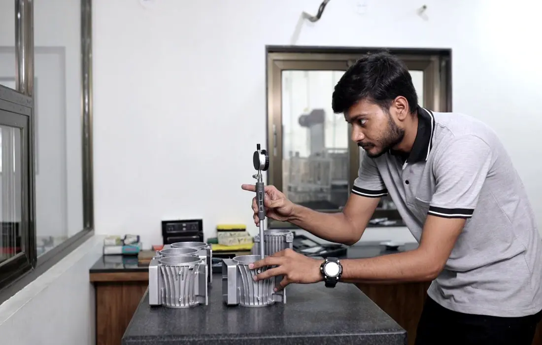 Engineer measuring machined component height